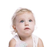 Baby Girl In A Red New Year Cap Royalty Free Stock Photography