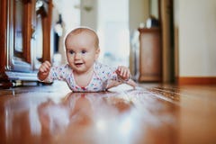 Baby Girl Learning To Crawl Royalty Free Stock Images