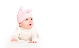 Baby girl in a pink hat with rabbit ears isolated on white royalty free stock images Baby girl in a pink hat with rabbit ears isolated on white royalty free stock images