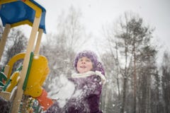 baby girl playing snowballs in winter Park stock photography baby girl playing snowballs in winter Park stock photography