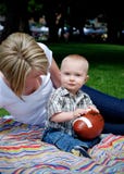 Baby Holding Football - Vertical Royalty Free Stock Photography Baby Holding Football - Vertical Royalty Free Stock Photography