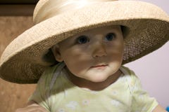 Baby In A Straw Hat Stock Image