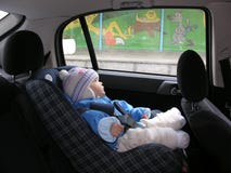 Baby In Car With Dreams In Window Stock Photos Baby In Car With Dreams In Window Stock Photos