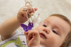 Baby Is Holding Pacifier Clip For Nipple Stock Image Baby Is Holding Pacifier Clip For Nipple Stock Image