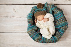 Baby newborn sleeping in woolen hat on white wood royalty free stock image Baby newborn sleeping in woolen hat on white wood royalty free stock image