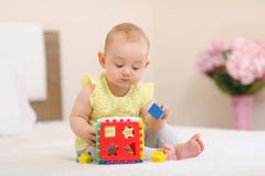 Baby is playing in bed. royalty free stock photography Baby is playing in bed. royalty free stock photography