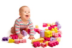 Baby playing in designer toy blocks