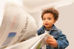 Baby Reads New York Times Royalty Free Stock Photography Baby Reads New York Times Royalty Free Stock Photography