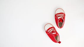 Baby red sneakers isolated on white background. baby shoes royalty free stock image Baby red sneakers isolated on white background. baby shoes royalty free stock image