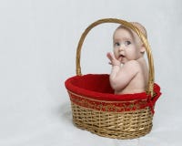 Baby sitting in Christmas Gift Basket stock images Baby sitting in Christmas Gift Basket stock images