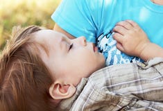 Baby sleeps in the arms of her mother. stock photography Baby sleeps in the arms of her mother. stock photography