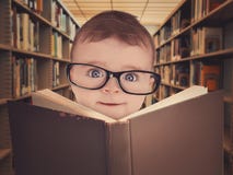 Baby With Eye Glasses Reading Library Book Stock Photo Baby With Eye Glasses Reading Library Book Stock Photo