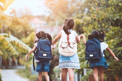 Asian pupil kids with backpack going to school Royalty Free Stock Photo Asian pupil kids with backpack going to school Royalty Free Stock Photo