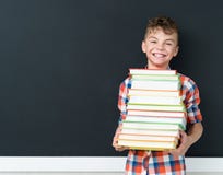 Back to school concept - schoolboy with books Royalty Free Stock Photos Back to school concept - schoolboy with books Royalty Free Stock Photos