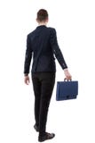 back view of a business man holding a briefcase and walking forward onwhite background stock photos back view of a business man holding a briefcase and walking forward onwhite background stock photos