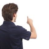 Back view of a man pushing button in the air stock photo Back view of a man pushing button in the air stock photo