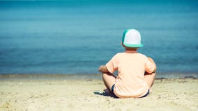 Back View Of Cute Boy On The Seaside. Summer Vacation. Royalty Free Stock Photography
