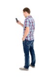 Back view of standing young men and using a mobile phone royalty free stock photography Back view of standing young men and using a mobile phone royalty free stock photography