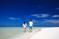 Back view of young couple on white beach. Vacation concept royalty free stock image Back view of young couple on white beach. Vacation concept royalty free stock image