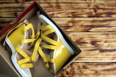 Yellow new sandals are in a cardboard box stock photo Yellow new sandals are in a cardboard box stock photo