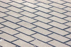 Background in the form of bricks, grey paving slabs. Monotone Gray Brick Stone on The Ground for Street Road royalty free stock photo Background in the form of bricks, grey paving slabs. Monotone Gray Brick Stone on The Ground for Street Road royalty free stock photo