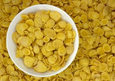 Background of goldish corn flakes with dish royalty free stock photo Background of goldish corn flakes with dish royalty free stock photo