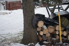 Background with Winter Snow Logs and Wheelbarrow royalty free stock photo Background with Winter Snow Logs and Wheelbarrow royalty free stock photo