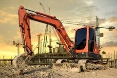 Backhoe pobyt męczył ciężka praca w budowa terenie fotografia stock Backhoe pobyt męczył ciężka praca w budowa terenie fotografia stock