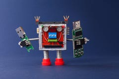 Backup information concept. Robot with portable devices usb flash stick. Macro view, blue background stock photography Backup information concept. Robot with portable devices usb flash stick. Macro view, blue background stock photography