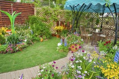 Backyard flower garden Stock Photo Backyard flower garden Stock Photo