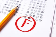 Bad Grade F Is Written With Red Pen On The Tests Royalty Free Stock Image