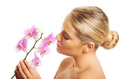 Badekurortfrau mit purpurroter Orchidee Stockbilder Badekurortfrau mit purpurroter Orchidee Stockbilder