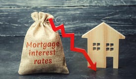 Bag with the money and the word Mortgage interest rates and arrow to down and house. Low interest in mortgages. Reducing interest