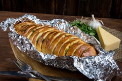 Baguette with garlic, cheese and herbs stock photo Baguette with garlic, cheese and herbs stock photo