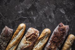 Baguette mix on a black background. French pastries, homemade. stock image Baguette mix on a black background. French pastries, homemade. stock image