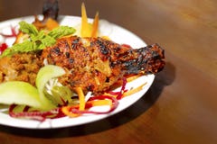 Baked chicken legs in spicy glaze sauce on white plate royalty free stock photography Baked chicken legs in spicy glaze sauce on white plate royalty free stock photography