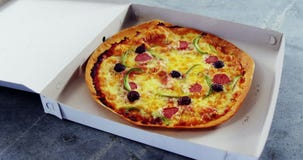 Baked pizza with olive and peperoni toppings stock video footage Baked pizza with olive and peperoni toppings stock video footage