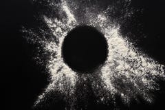 Baking concept on black background, sprinkled flour circle with copy space stock image Baking concept on black background, sprinkled flour circle with copy space stock image