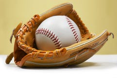 Ball in kids glove Royalty Free Stock Photo Ball in kids glove Royalty Free Stock Photo