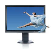 Ballerina Jumping Into A Monitor Royalty Free Stock Photography