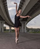 Ballerina out of doors, young modern ballet dancer posing on the royalty free stock image Ballerina out of doors, young modern ballet dancer posing on the royalty free stock image