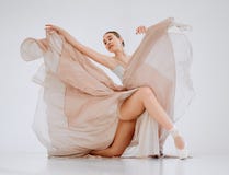 Ballet is one of the most elegant styles of dancing. Full length shot of an attractive young female ballerina practicing