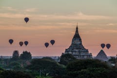 Balloons over Bagan and the skyline of its temples, Myanmar. Sulamani temple and Shwesandaw pagod