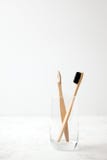 Bamboo teeth brush on minimalistic backgroud. zero waste concept, white background, eco friendly modern simple idea, copy space
