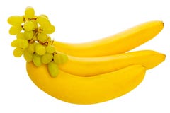 Bananas suculentas brilhantes e uvas verdes, ainda vida bonita Imagem de Stock Royalty Free Bananas suculentas brilhantes e uvas verdes, ainda vida bonita Imagem de Stock Royalty Free