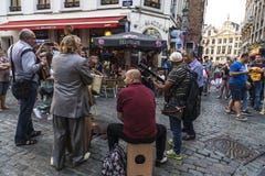 Band of street musicians on a street in Brussels, Belgium stock image Band of street musicians on a street in Brussels, Belgium stock image