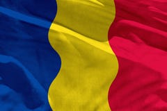 A bandeira de ondulação de Romênia para usar-se como a textura ou o fundo, a bandeira está vibrando no vento fotografia de stock A bandeira de ondulação de Romênia para usar-se como a textura ou o fundo, a bandeira está vibrando no vento fotografia de stock