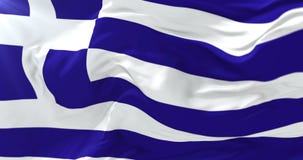 Bandeira grega que acena no vento com céu azul, laço Bandeira grega que acena no vento com céu azul, laço