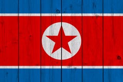 Bandiera della Corea del Nord dipinta sulla vecchia plancia di legno fotografia stock libera da diritti Bandiera della Corea del Nord dipinta sulla vecchia plancia di legno fotografia stock libera da diritti