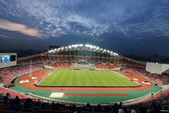Bangkok , Thailand - December 8 ,2016 : Crowd of people in Rajamangala national football stadium of Thailand against colorful twil Stock Images Bangkok , Thailand - December 8 ,2016 : Crowd of people in Rajamangala national football stadium of Thailand against colorful twil Stock Images
